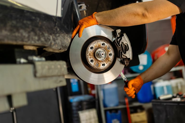 Mechanic repairing brake disc